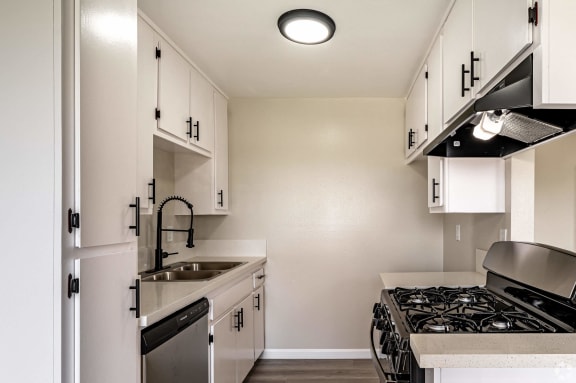 the preserve at ballantyne commons apartment kitchen with stove and sink at Colima Terrace Apts, Rowland Heights, CA