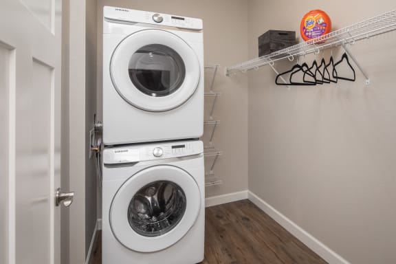 a washer and dryer in a laundry roomat The Carver Apartments, Chaska, MN 55318