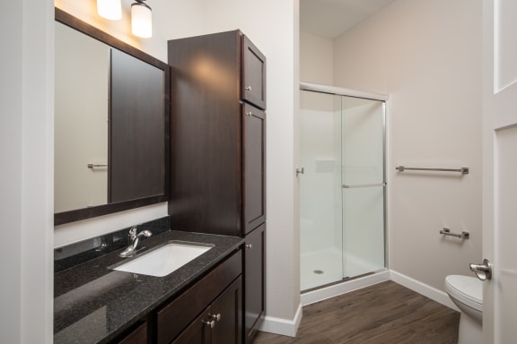 a bathroom at homewood suites by hilton houston stafford sugar landat The Carver Apartments, Chaska
