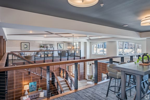 a view of a living room and dining room from a balcony