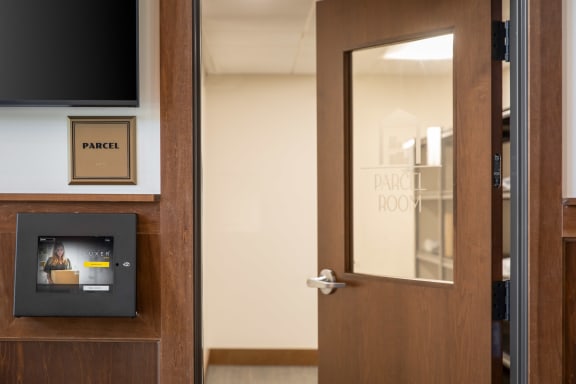 a door to a room with a paper box on the side of it