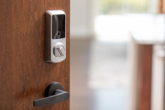 a door with a remote control on the door handle