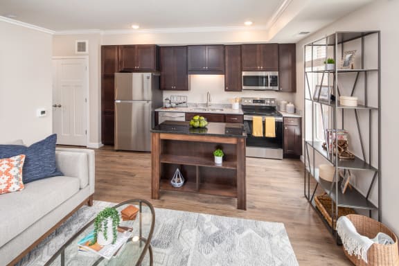 a kitchen and living room in a 555 waverly unitat The Carver Apartments, Chaska, 55318