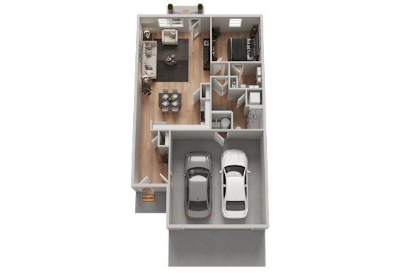 A floor plan of a house with two cars parked in the garage.