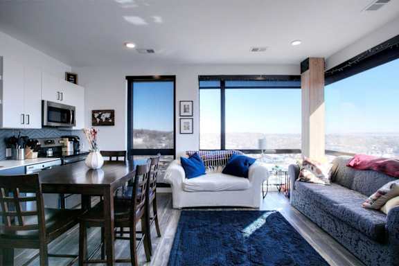 A modern living room with a view of the city.