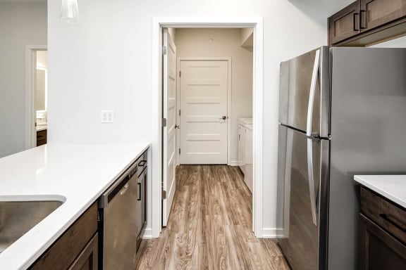 One, two and three-bedroom floor plans featuring two interior design schemes, quartz countertops, tile backsplash, stainless steel appliances, backlit mirrors, high-end finishes and more at 148 Place Apartments in Omaha, NE