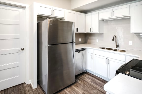One, two and three-bedroom floor plans featuring two interior design schemes, quartz countertops, tile backsplash, stainless steel appliances, backlit mirrors, high-end finishes and more at 148 Place Apartments in Omaha, NE