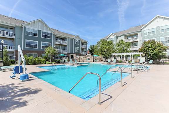 Resort-style pool with sundeck at Aventine at Wilderness Hills in Lincoln, NE