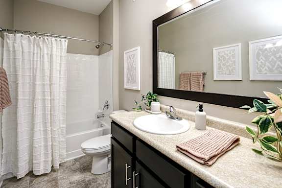 Upscale Bathroom with Designer Fixtures & Ceramic Tiled Floors at Aventine at Wilderness Hills in Lincoln, NE
