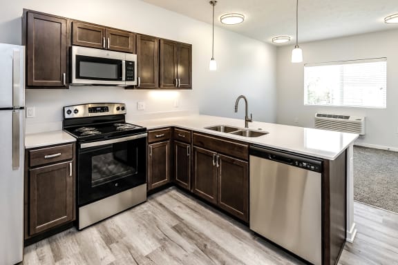 Kitchen with stainless steel appliances at Belle Point in Bellevue, NE