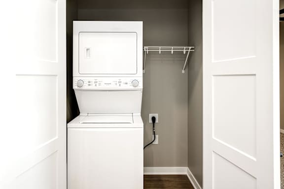 A white oven and microwave in a small kitchen.