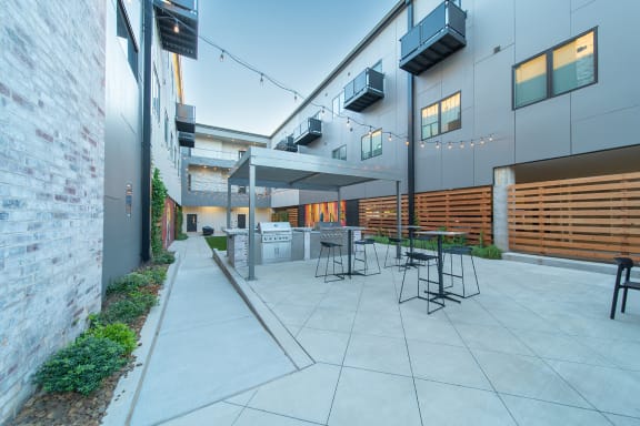 Private Outdoor Courtyard with Yard Games, Grills and Fire Pit at G at Market in Bentonville, AR