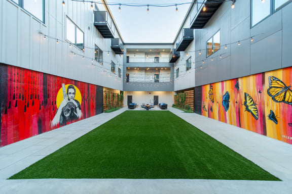 Private Outdoor Courtyard with Yard Games, Grills and Fire Pit at G at Market in Bentonville, AR