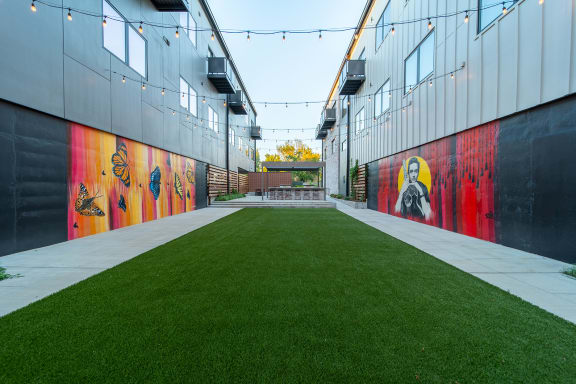 Private Outdoor Courtyard with Yard Games, Grills and Fire Pit at G at Market in Bentonville, AR