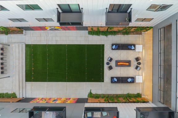Private Outdoor Courtyard with Yard Games, Grills and Fire Pit at G at Market in Bentonville, AR