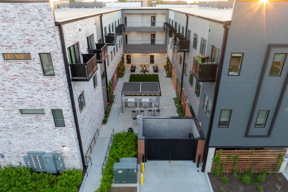 Private Outdoor Courtyard with Yard Games, Grills and Fire Pit at G at Market in Bentonville, AR