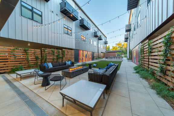 Private Outdoor Courtyard with Yard Games, Grills and Fire Pit at G at Market in Bentonville, AR