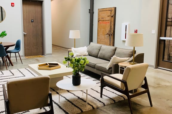 a living room filled with furniture and a rug