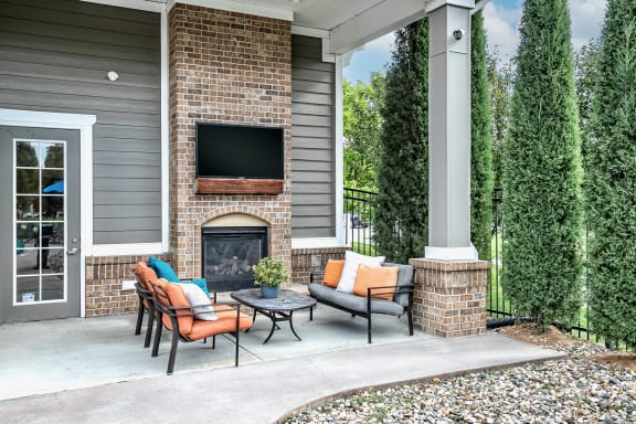 Poolside fireplace and seating area at Legacy Commons Apartments in Omaha, NE