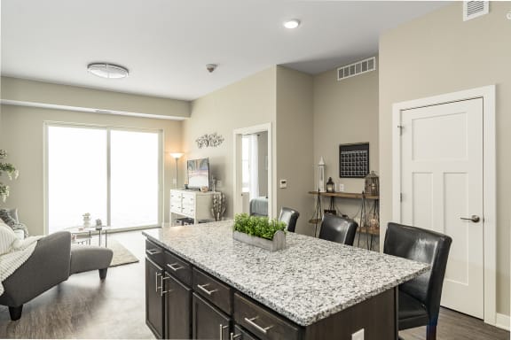 Granite Kitchen Island at The Nexus at Gray's Landing in Downtown Des Moines, NE