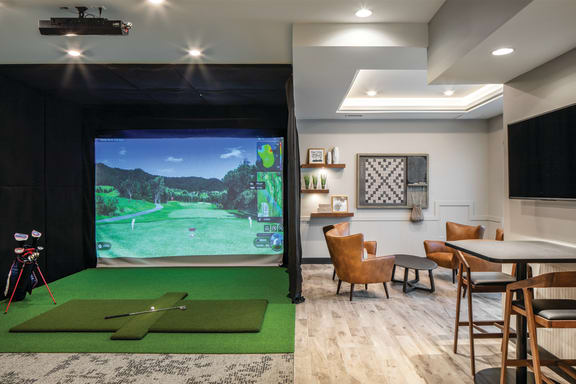 Game room with golf simulator at Park125 in Omaha, NE