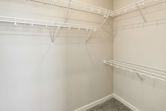 Empty white shelving unit in a room.