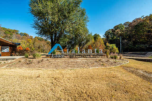 A playground with a slide and a sign that says "Takalana".