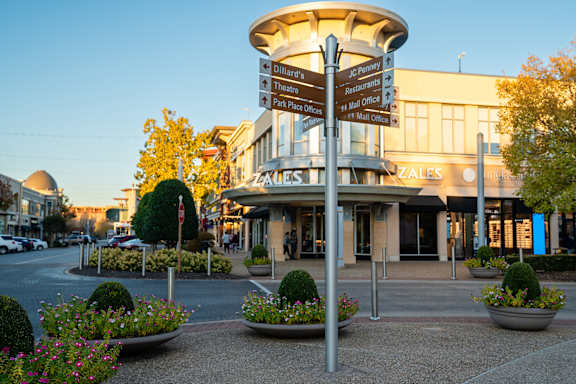 Located by nearby shops and dining at The Grove in Rogers, AR