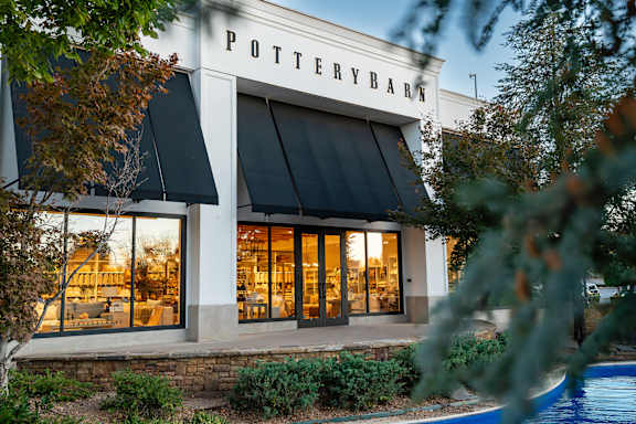 Located by nearby shops and dining at The Grove in Rogers, AR