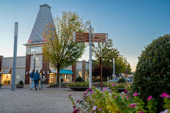 Located by nearby shops and dining at The Grove in Rogers, AR