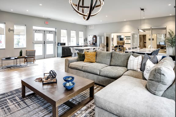 Clubhouse With grey sofa at Sandstone Villas Apartments, Omaha, NE 68116