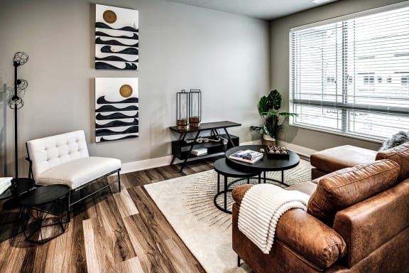 Living Room with large windows at The Sterling Prairie Trail North in Ankeny, IA