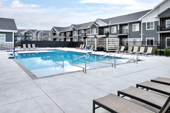 Heated Outdoor Pool with Outdoor Entertaining Area at The 8801 in Lincoln, NE