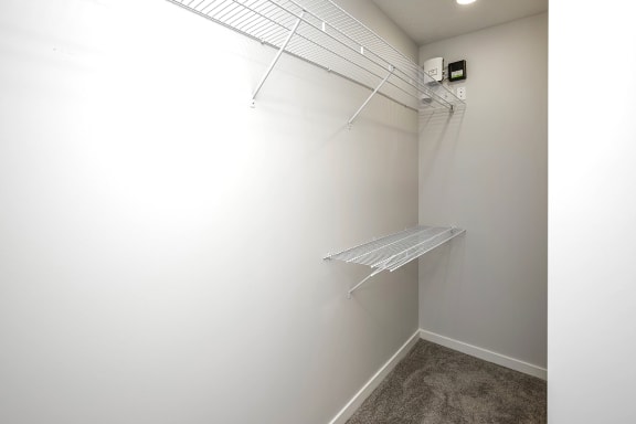 Spacious one and two-bedroom apartments featuring three interior schemes, granite countertops, stainless steel appliances, large kitchens, high-end lighting, vinyl plank flooring and much more at The Brink at Ridgeview in Plattsmouth, NE