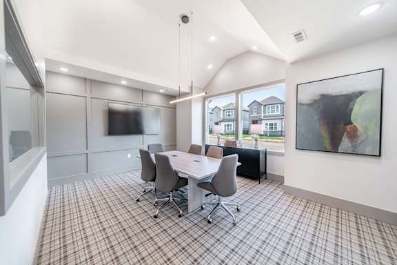 the preserve at ballantyne commons conference room with table and chairs and a tv