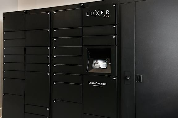 A black locker with the word LUXER on the top.