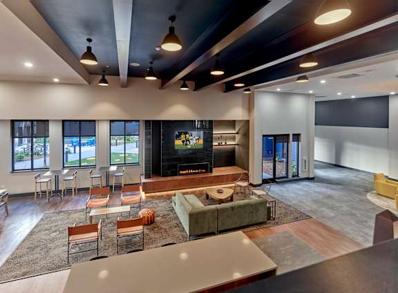 A modern living room with a fireplace and a television.