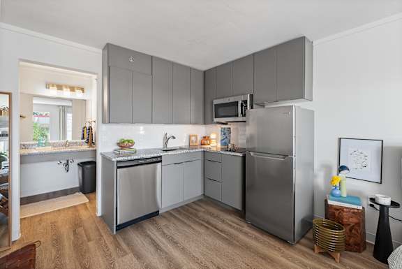 A modern kitchen with a refrigerator, microwave, and oven. at The Teale Navy Yard, North Charleston, SC, 29405