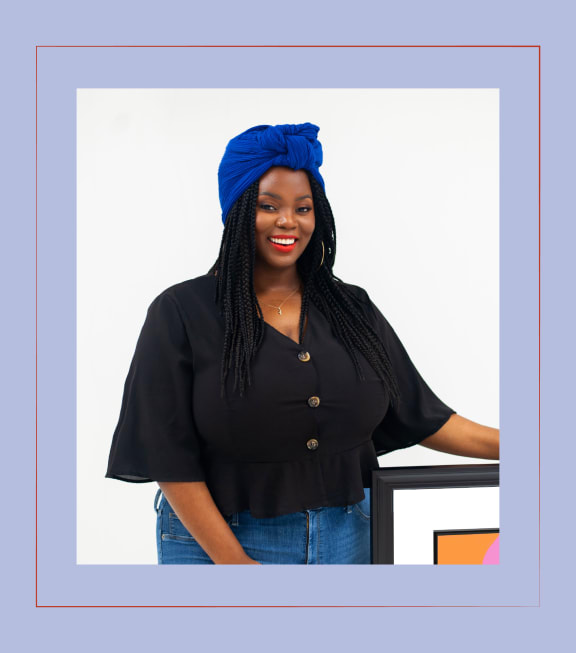 A woman with a blue head wrap is standing in front of a white background. at The Lady, South Carolina