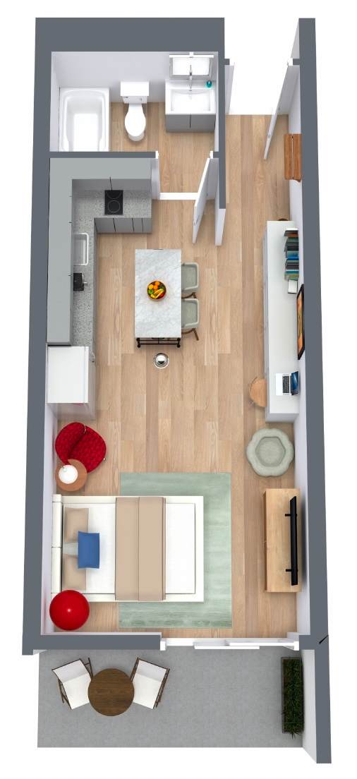 A top down view of a living room with a couch, chair, and coffee table at The Teale Golden Gate in Naples, FL, 34116