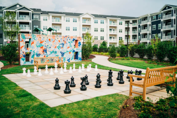 a large chess set in front of an apartment building at The Roseberry, Columbia, 29223
