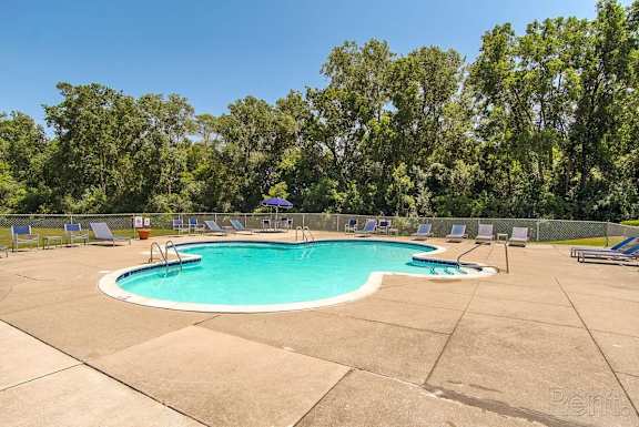 A small pool surrounded by trees and chairs. at Plymouth Heritage - Plymouth, MI, MI, Plymouth Michigan