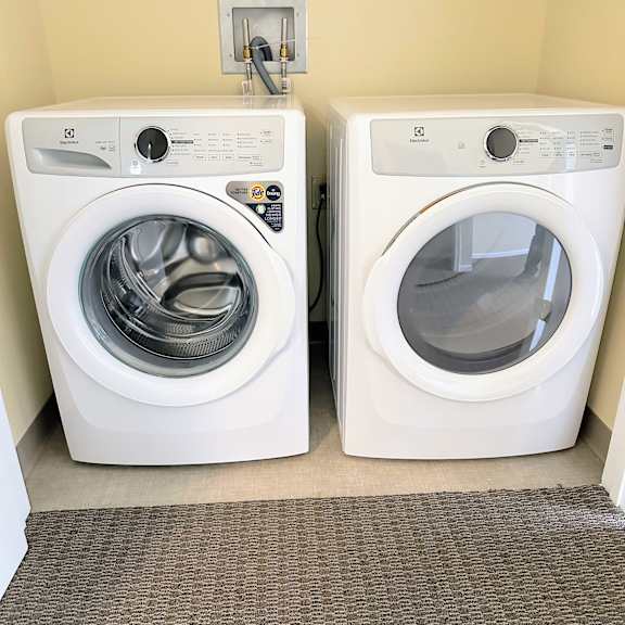 a washer and dryer in a room next to a washing machine