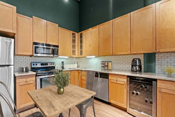 Kitchen and living area. Lowertown Lofts  in St. Paul, MN 3 Bedroom 2.5 Bath Plus Den Apartment  at Lowertown Lofts, Minnesota