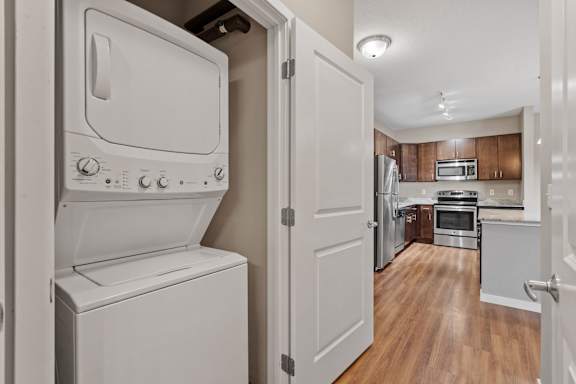 A white oven and dishwasher in a kitchen.