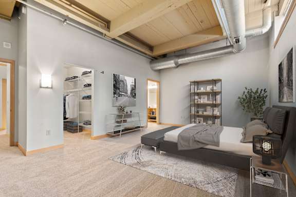 Bedroom and bathroom. Lowertown Lofts  in St. Paul, MN 3 Bedroom 2.5 Bath Plus Den Apartment  at Lowertown Lofts, Minnesota