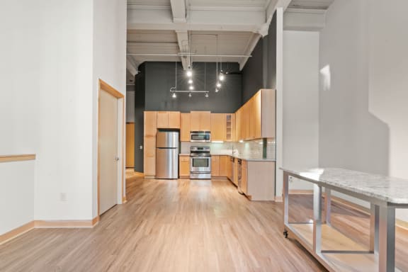 Kitchen and living area. Lowertown Lofts  in St. Paul, MN 3 Bedroom 2.5 Bath Plus Den Apartment  at Lowertown Lofts, Minnesota