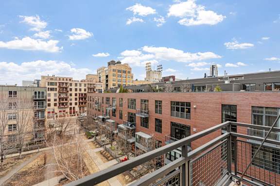 A view of a cityscape from a balcony.