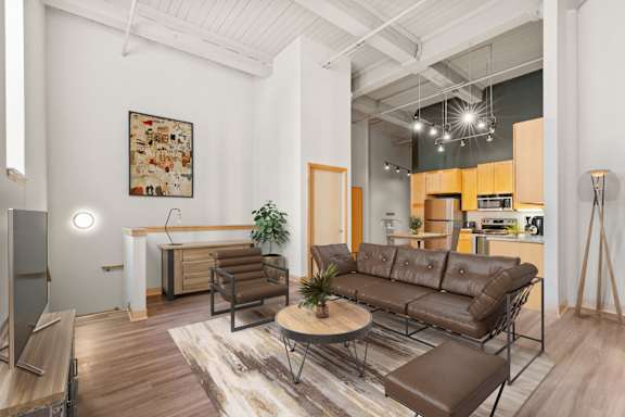 Kitchen and living area. Lowertown Lofts  in St. Paul, MN 3 Bedroom 2.5 Bath Plus Den Apartment  at Lowertown Lofts, Minnesota