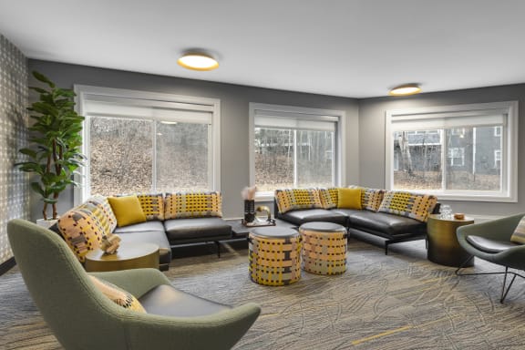 a living room with couches and chairs and windows  at Cedars Lakeside, Little Canada, MN, 55117